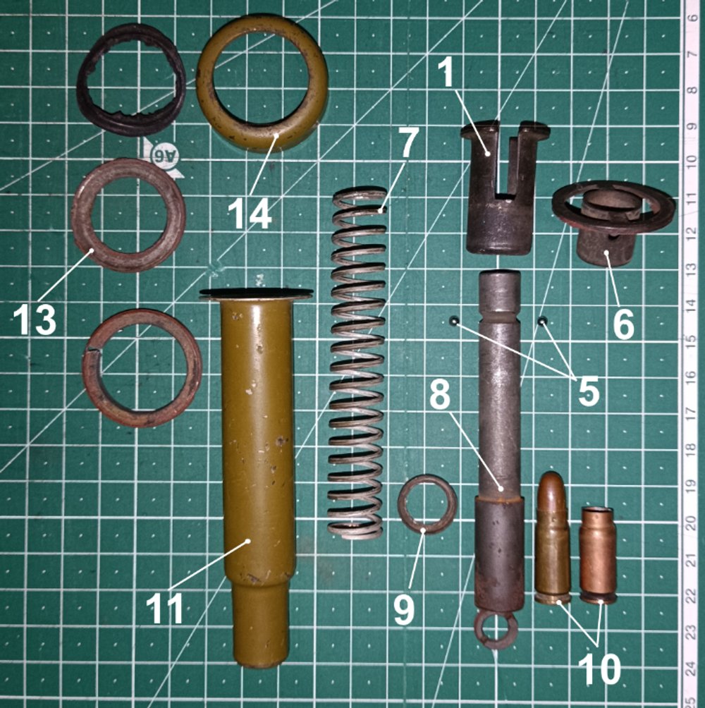 Міна ПМП: 1 - втулка; 5 - кульки; 6 - муфта; 7 - бойова пружина; 8 - ствол; 9 - шайба; 10 - пістолетний патрон; 11 - корпус; 13 - гайка; 14 - накидна гайка